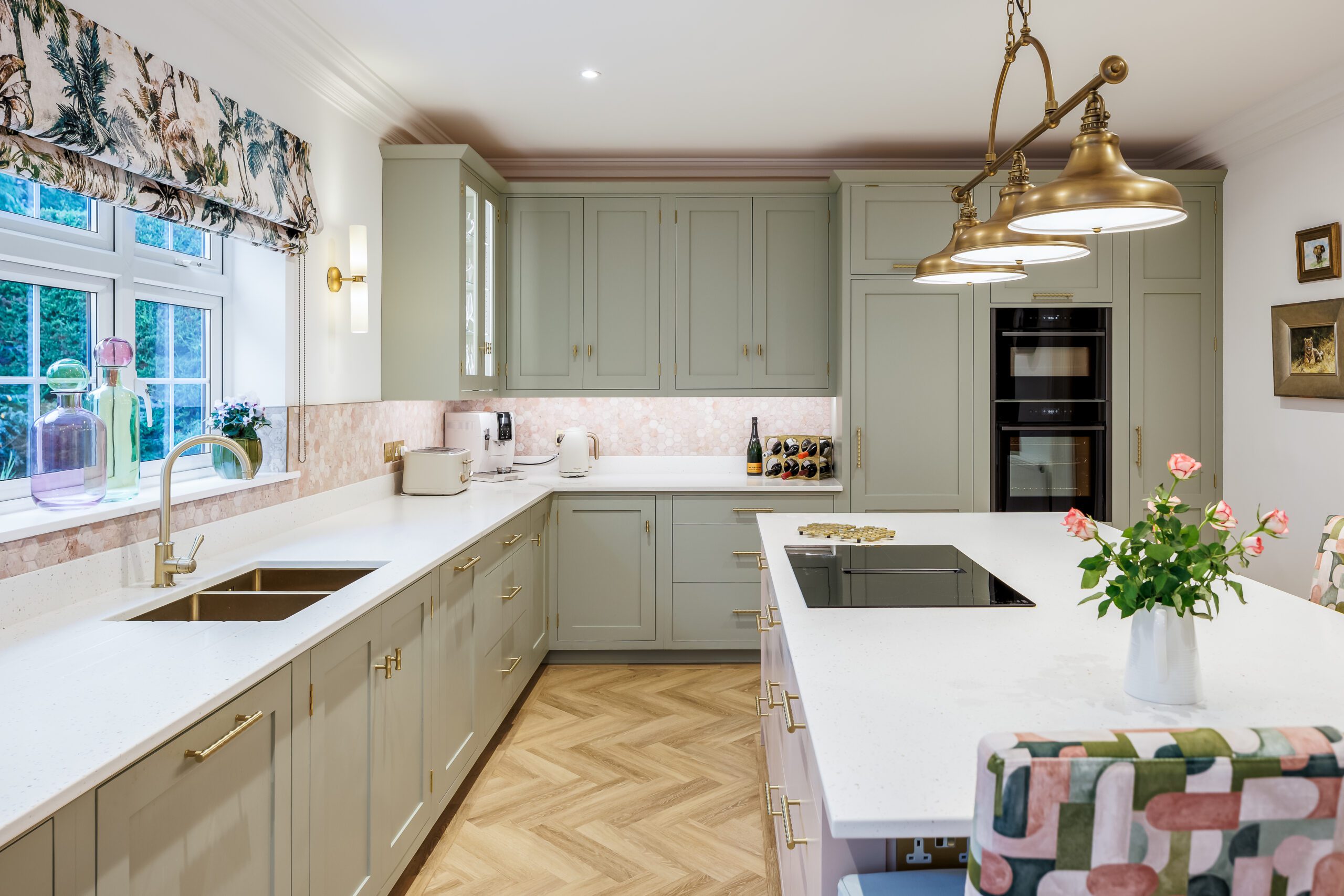 a kitchen with a large island and a large sink